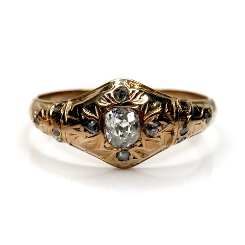 259 - Two gold and diamond rings, one set with a round cut diamond, 4.5 by 2.1mm, size O/P, 4.6g, the othe... 