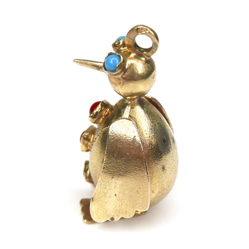 214 - An 18ct yellow gold novelty pendant, in the form of a penguin, with turquoise eyes and three red cor... 