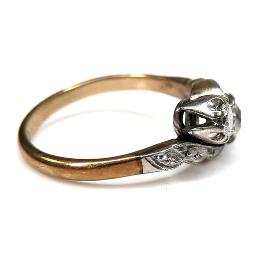 266 - An 18ct yellow gold, platinum, and diamond three stone ring, set in an angled row, the central large... 