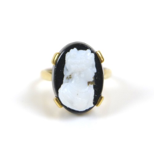 177 - An 18ct gold mourning cameo ring, the cameo of a lady in profile, mounted on black, 10 by 13mm, stam... 