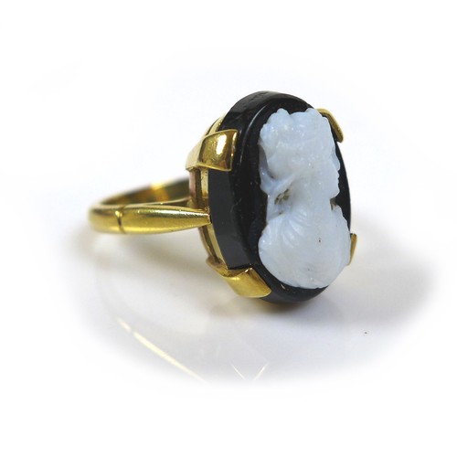 177 - An 18ct gold mourning cameo ring, the cameo of a lady in profile, mounted on black, 10 by 13mm, stam... 