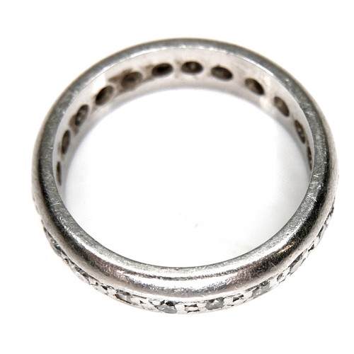 195 - A white gold or platinum full eternity ring, set with twenty round cut diamonds, each 0.015ct, 1.5mm... 