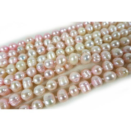 156 - A group of three 'flapper' pearl necklaces, all with no clasps, misshapen but mainly round pearls, t... 