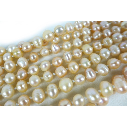 156 - A group of three 'flapper' pearl necklaces, all with no clasps, misshapen but mainly round pearls, t... 