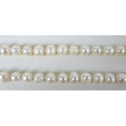 156 - A group of three 'flapper' pearl necklaces, all with no clasps, misshapen but mainly round pearls, t... 