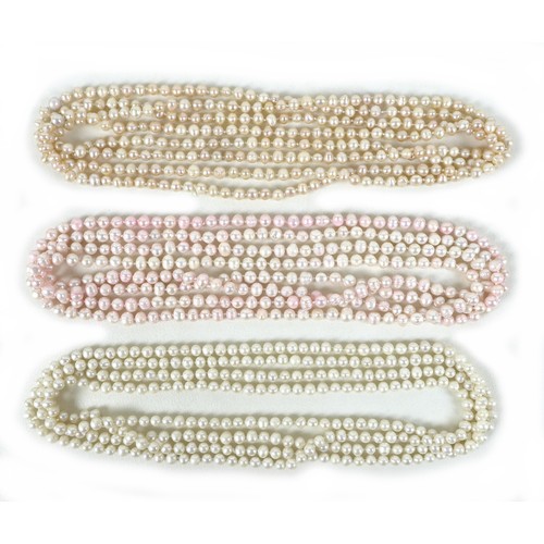 156 - A group of three 'flapper' pearl necklaces, all with no clasps, misshapen but mainly round pearls, t... 