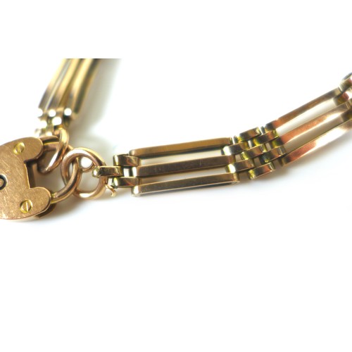 227 - A 9ct gold and yellow metal gate link bracelet, with 9ct gold padlock clasp (without safety chain) a... 