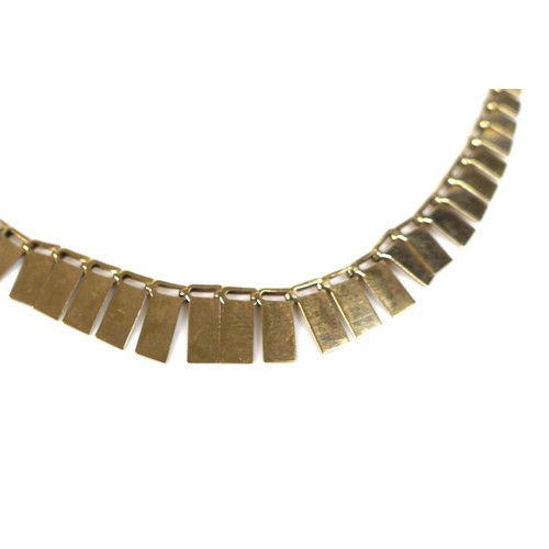 165 - A yellow metal Cleopatra style necklace, with graduated rectangular panels, bearing an indistinct ma... 