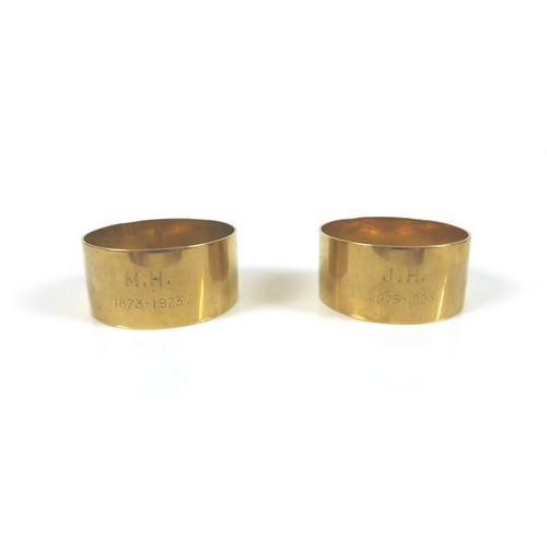 296 - A pair of George V 9ct gold napkin rings, one engraved 'J.H. 1873-1923' the other 'M.H. 1873-1923', ... 