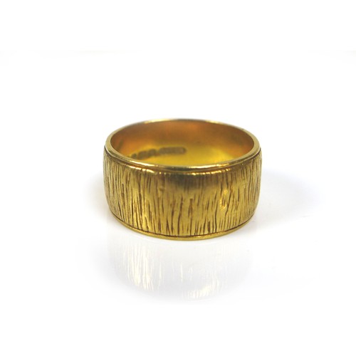 253 - An 18ct gold band ring, size N, 7.7g.