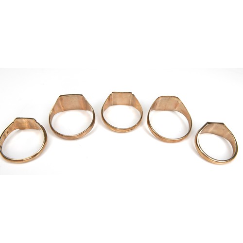 264 - A group of five 9ct yellow gold signet rings, with engraved decoration, 8.8 to 12.0mm wide, sizes L ... 