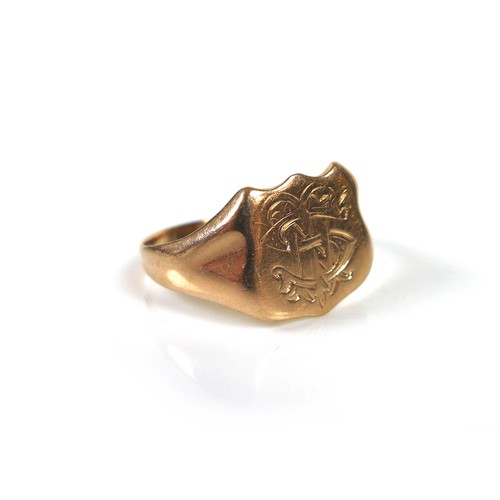 172 - A 9ct yellow gold signet ring, the shield engraved with a monogram 'THS', size R, 3.8g.