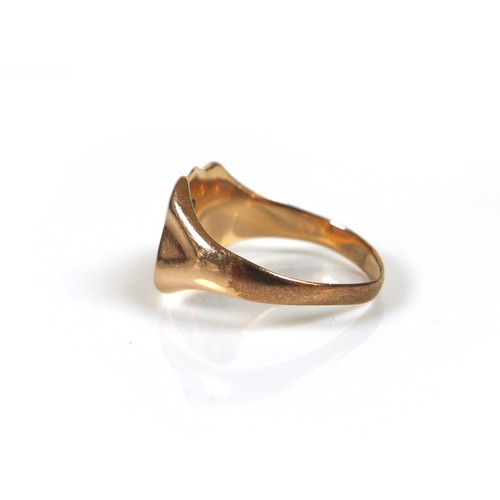 172 - A 9ct yellow gold signet ring, the shield engraved with a monogram 'THS', size R, 3.8g.