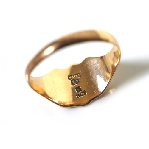 172 - A 9ct yellow gold signet ring, the shield engraved with a monogram 'THS', size R, 3.8g.