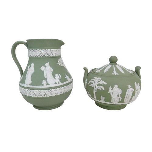 20 - A collection of Wedgwood Jasperware items, including a lamp base of urn form decorated in the typica... 