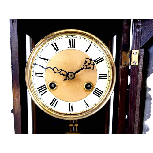 60 - An early 20th century mahogany and stained pine Vienna wall clock, with pendulum and key, a/f missin... 