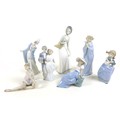 A collection of Lladro and Nao figurines, comprising 'Graceful Pose', boxed, 'Flirt', 'Wedding Bells... 