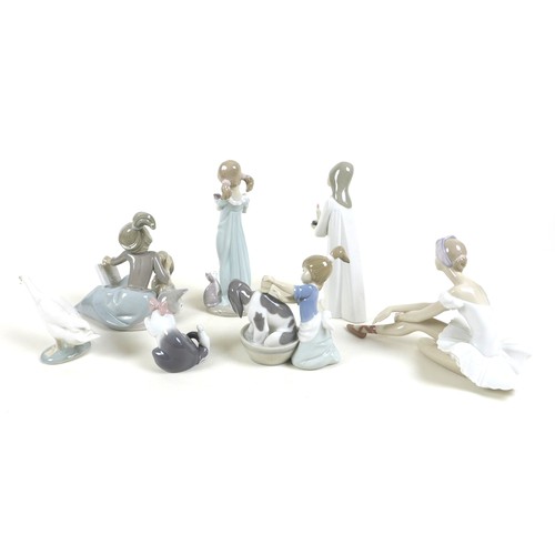 29 - A collection of Lladro and Nao figurines, comprising 'Cat and Mouse', boxed, 'Don't Forget Me', boxe... 