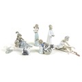 A collection of Lladro and Nao figurines, comprising 'Cat and Mouse', boxed, 'Don't Forget Me', boxe... 