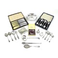 A small group of silver and silver plated items, including a silver charm bracelet and spare charms,... 