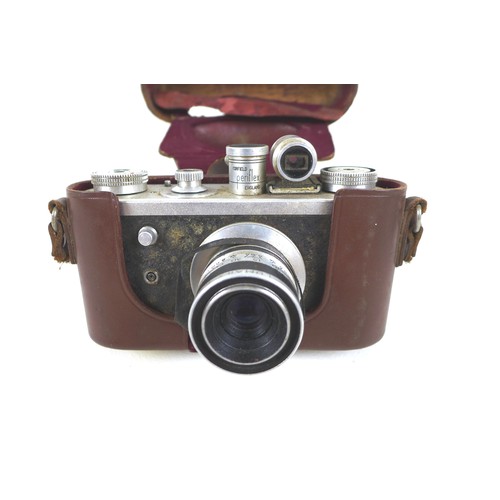 77 - A Corefield Periflex 35mm camera, Lumar-X lens, circa 1930s, in brown leather case, plus a Unattix f... 