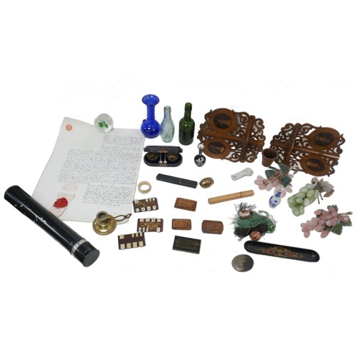 81 - A group of assorted collectables, including whist counters, a small spill vase with white metal over... 