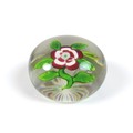 A Baccarat paperweight, mid/late 19th century, clear glass with white and red primrose with bud on s... 