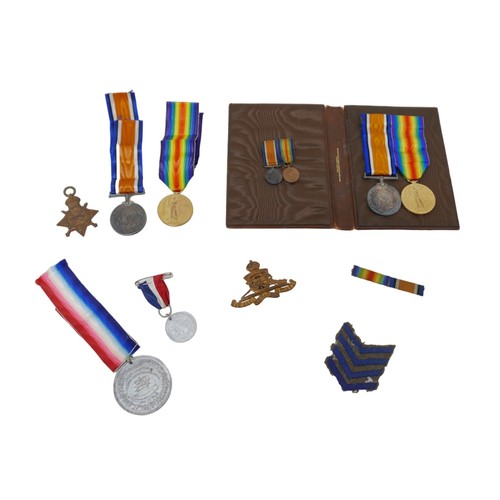 65 - Two sets of WWI medals with recipients from the same family, comprising  a 1914-15 star, War medal a... 