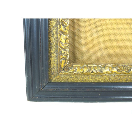 80 - An ebonised and gilt wood glazed picture frame, inside 41 by 30.5cm, outer frame 52 by 42cm.