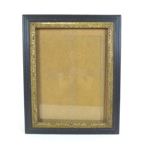 80 - An ebonised and gilt wood glazed picture frame, inside 41 by 30.5cm, outer frame 52 by 42cm.