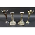 A pair of Edward VII silver Corinthian column candlesticks, stepped square bases, with bead decorati... 