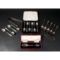 A collection of silver flatware, mainly spoons, including a set of five rat tail teaspoons, with 'A+... 