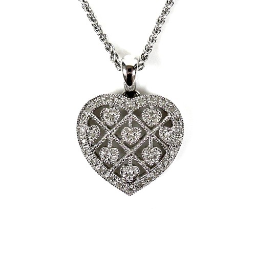 A Penny Preville 14ct white gold heart shaped pendant necklace, set about with round cut diamonds, pendant 16.5 by 17.5 by 4.0mm, chain 39cm long, 6.2g total.
