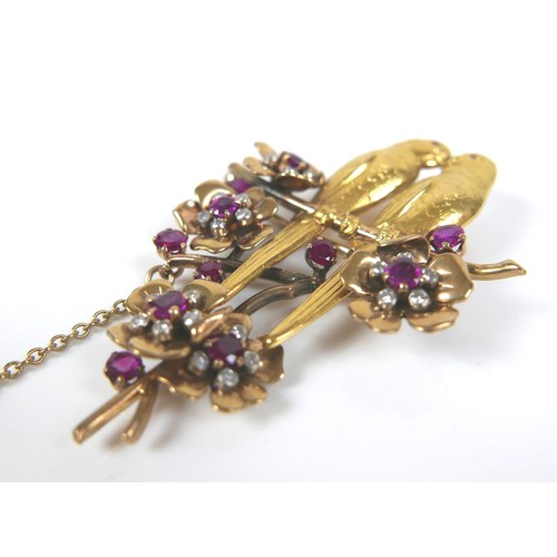 259 - An 18ct yellow gold brooch, modelled as a pair of kissing parakeets on a branch, surrounded by five ... 