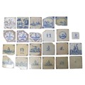 A collection of twenty-three 19th Century onwards delftware tiles, including examples depicting ship... 