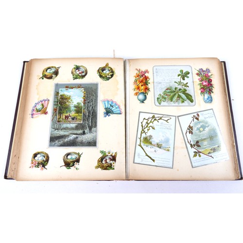 113 - A Victorian scrapbook, dated to a dedication page 'Christmas 1883', containing cutouts, postcards, a... 