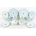 An Aynsley china part tea service, moulded leaf pattern in pale blue glaze centered by a painted spr... 