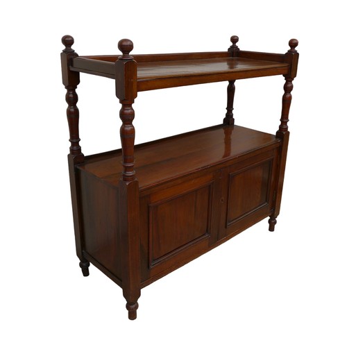 401 - An Edwardian mahogany buffet, two shelves, twin cupboard below, raised on turned feet.