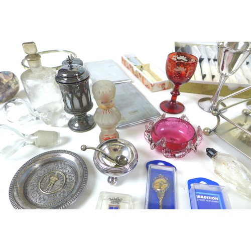 73 - A group of white metal and silver plated wares, including a number of spoons, some cranberry glass i... 