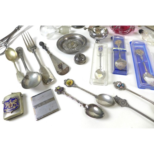 73 - A group of white metal and silver plated wares, including a number of spoons, some cranberry glass i... 