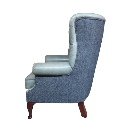 436 - A wingback armchair, recently re-upholstered in grey buttoned leather to the front and Harris tweed ... 