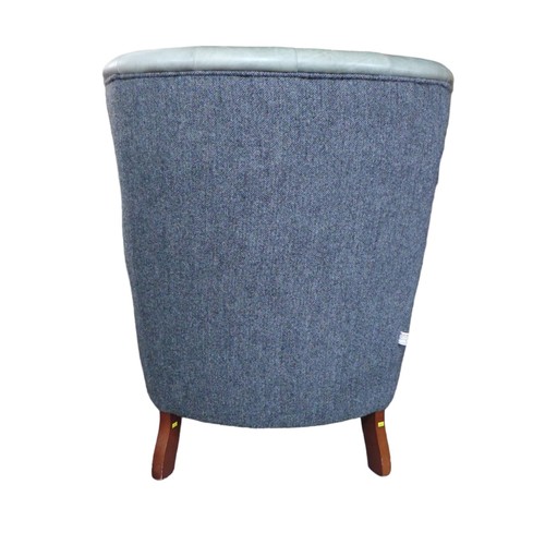 436 - A wingback armchair, recently re-upholstered in grey buttoned leather to the front and Harris tweed ... 