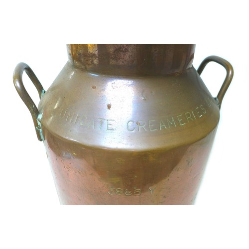 78 - A vintage copper milk churn, of cylindrical form with twin handles, branded for 'Unigate Creameries ... 