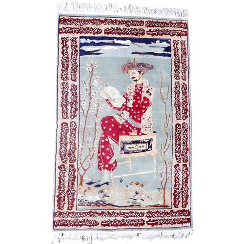 406 - A Persian rug, the central ground depicting a man in a red robe seated on a chair, surrounded by cal... 