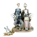A Lladro figural group, modelled as 'Lovers On A Bench In The Park', model 1274, with impressed fact... 