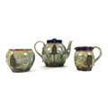 A Royal Doulton stoneware matched three piece tea service, circa 1900, decorated in Art Nouveau tast... 