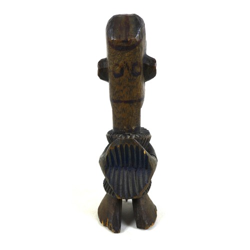 118 - An African carved wooden figure, mid 20th century, with traces of blue and green paint remaining, 20... 