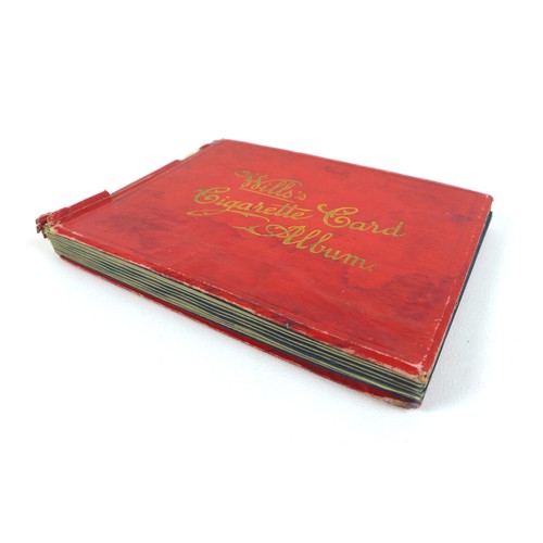 115 - A mid 20th century Will's Cigarette Card Album, red paper bound, containing approximately 150 Will's... 