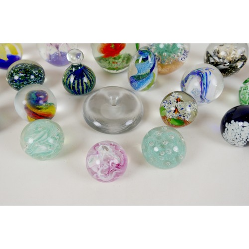 64 - A collection of modern glass paperweights, including Mdina, Malta - Phoenician, and one signed 'OG20... 