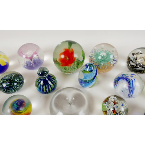 64 - A collection of modern glass paperweights, including Mdina, Malta - Phoenician, and one signed 'OG20... 